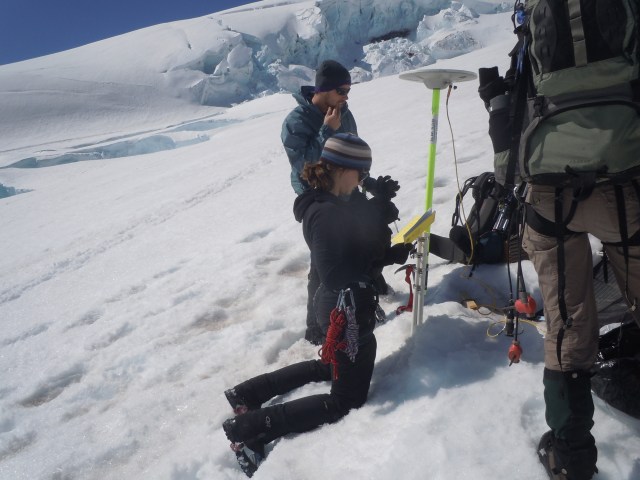 Me installing a seismometer (instrument to measure earthquake activity) on Mt. Rainier, with my all male field team.