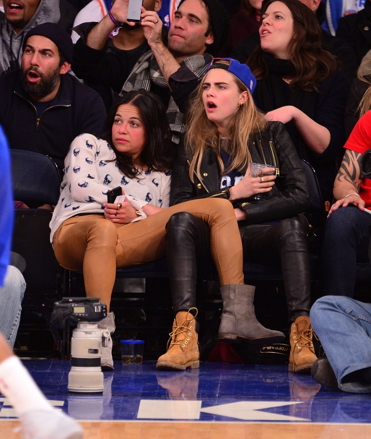 NEW YORK, NY - JANUARY 07: Michelle Rodriguez and Cara Delevingne attend the Detroit Pistons vs New York Knicks game at Madison Square Garden on January 7, 2014 in New York City. (Photo by James Devaney/FilmMagic)
