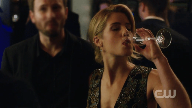 Felicity downing a glass of wine