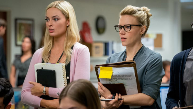 two blondes in a newsroom