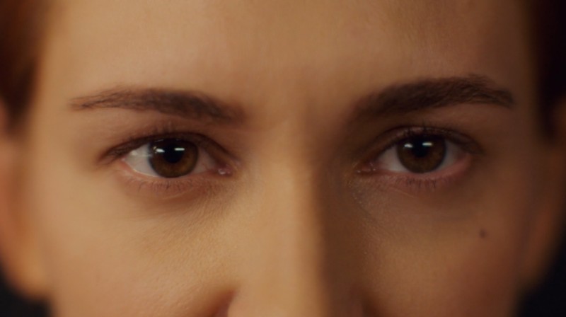 Close-up of Nicole's eyes returning Wynonna's gaze