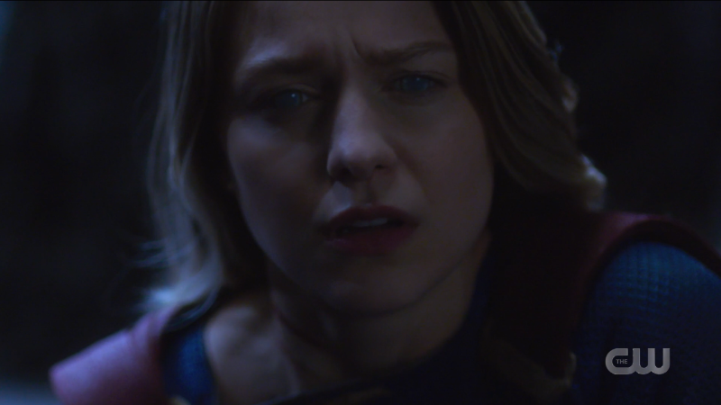 Supergirl Episode 607: Kara looks off into the middle distance with cloudy eyes, hopeless.
