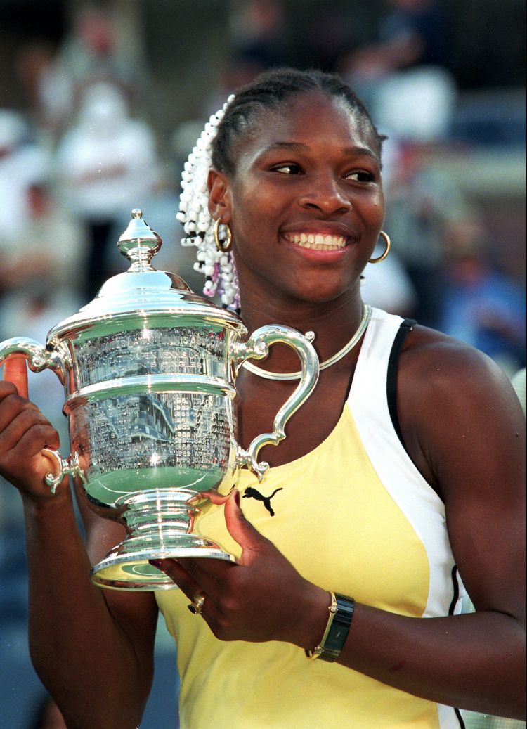 Serena Williams, the greatest athlete of all time, holding the US Open trophy in 1999 after her very first Grand Slam title