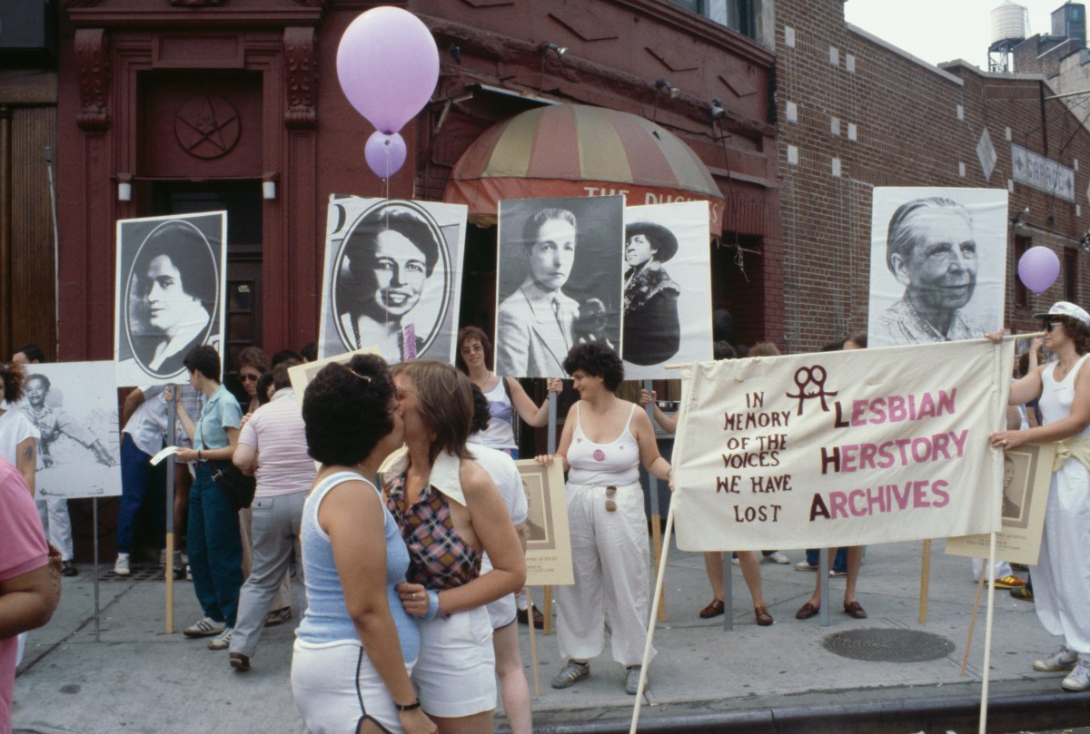The Duchess bar in the West Village, during the Pride Parade (later the LGBT Pride March) in New York City, June 1982. A banner reads 'In memory of the voices we have lost: Lesbian Herstory Archives'. Amongst the photographs are images of Eleanor Roosevelt and author Radclyffe Hall.