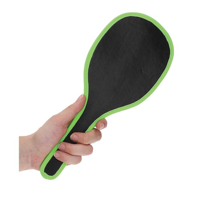 A black, leather paddle with glow-in-the-dark trim, called the Ouch! Glow In The Dark Round Paddle from Eve's Toys