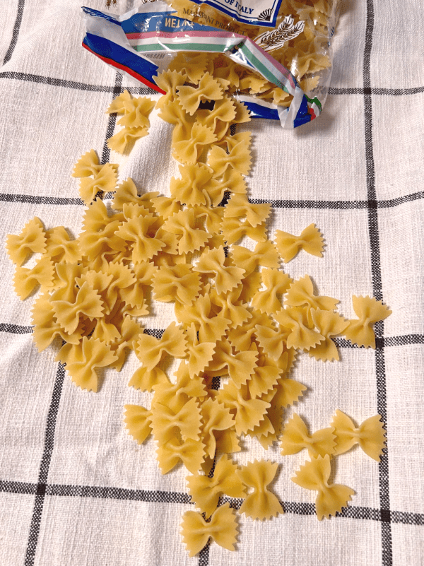 bowtie pasta spilling out of bag