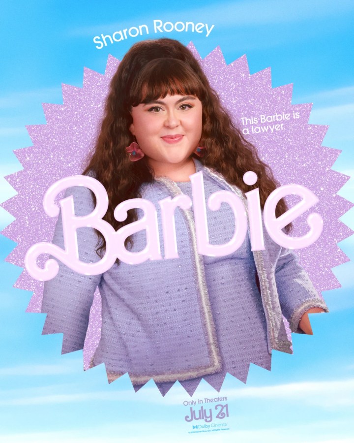 Sharon Rooney as Lawyer Barbie (she has on a lavender suit dress with a matching jacket set)
