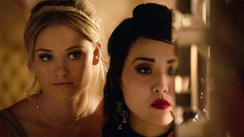 Virginia Gardner and Lyrica Okano as Karolina Dean and Nico Minoru