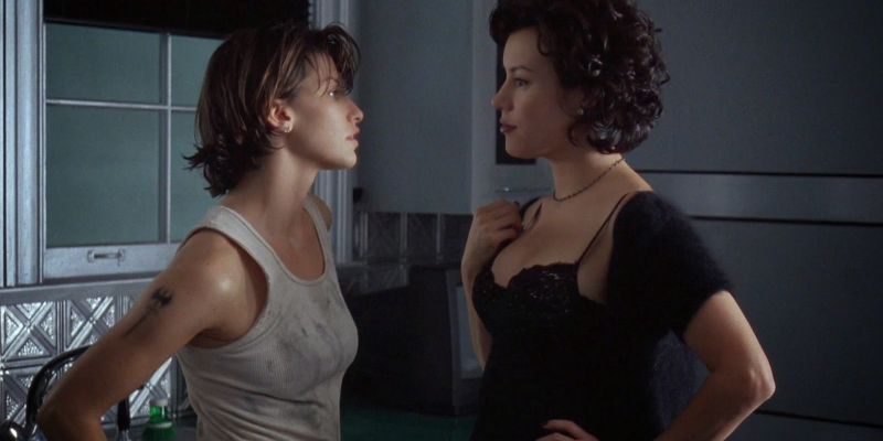 Jennifer Tilly and Gina Gershon make eye contact.