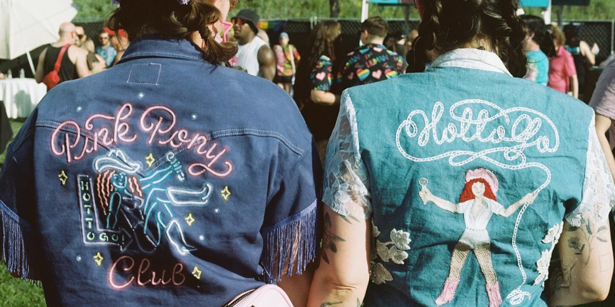two Chappell Roan fans wears jean jackets with PINK PONY CLUB and HOT TO GO on them