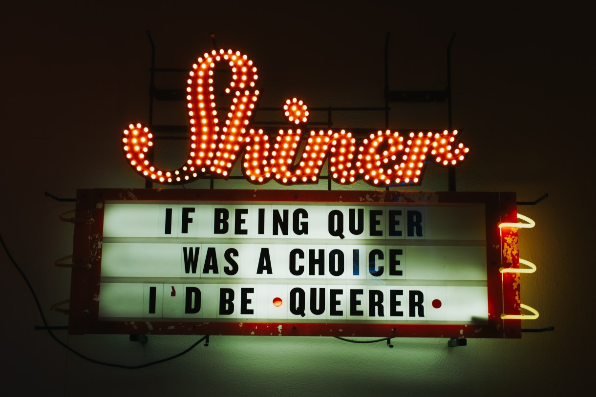A neon sign that says IF BEING QUEER WAS A CHOICE I'D BE QUEERER.