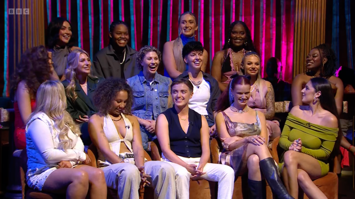 The entire cast of I Kissed a Girl sits together at the reunion