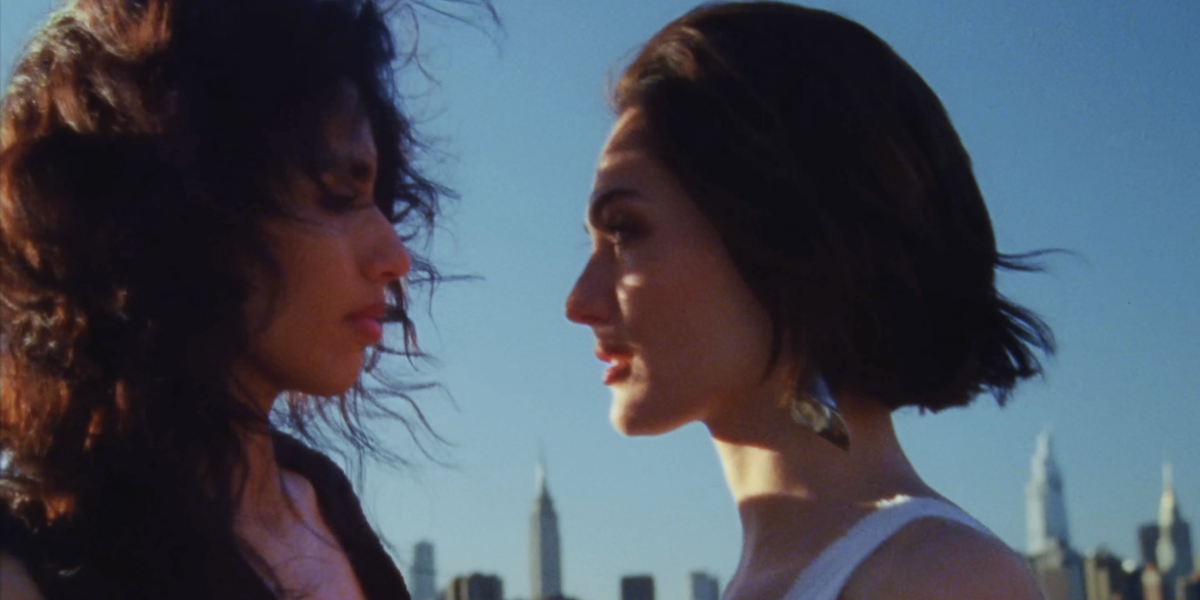 two women gaze into each other's eyes in the "Raat Ki Rani" music video