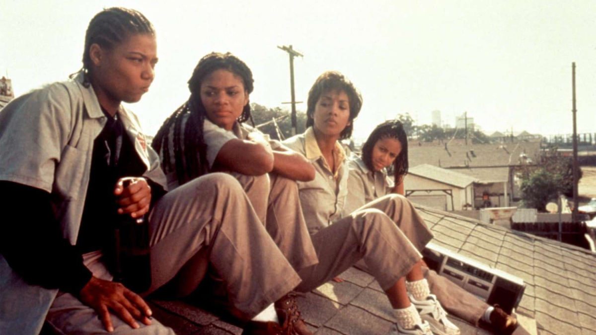Queen Latifah sits on a roof next to Kimberly Elise, Vivica A. Fox, and Jada Pinkett Smith