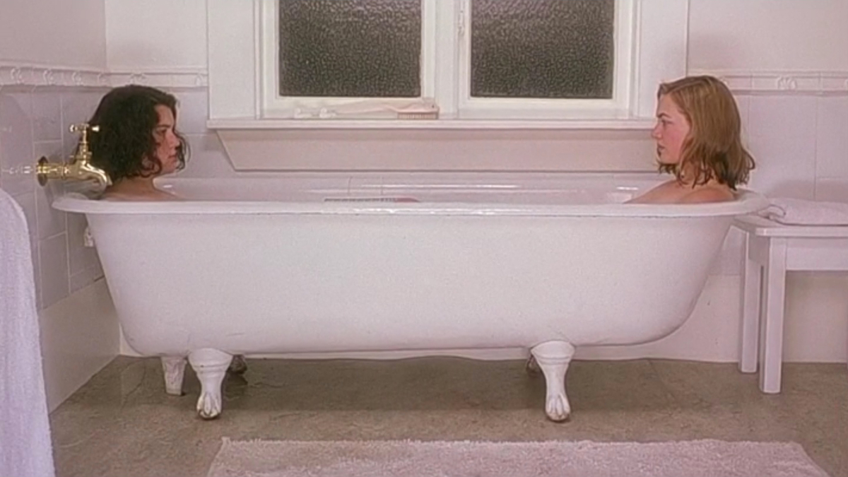 Kate Winslet and Melanie Lynskey sit on opposite sides of a bathtub.