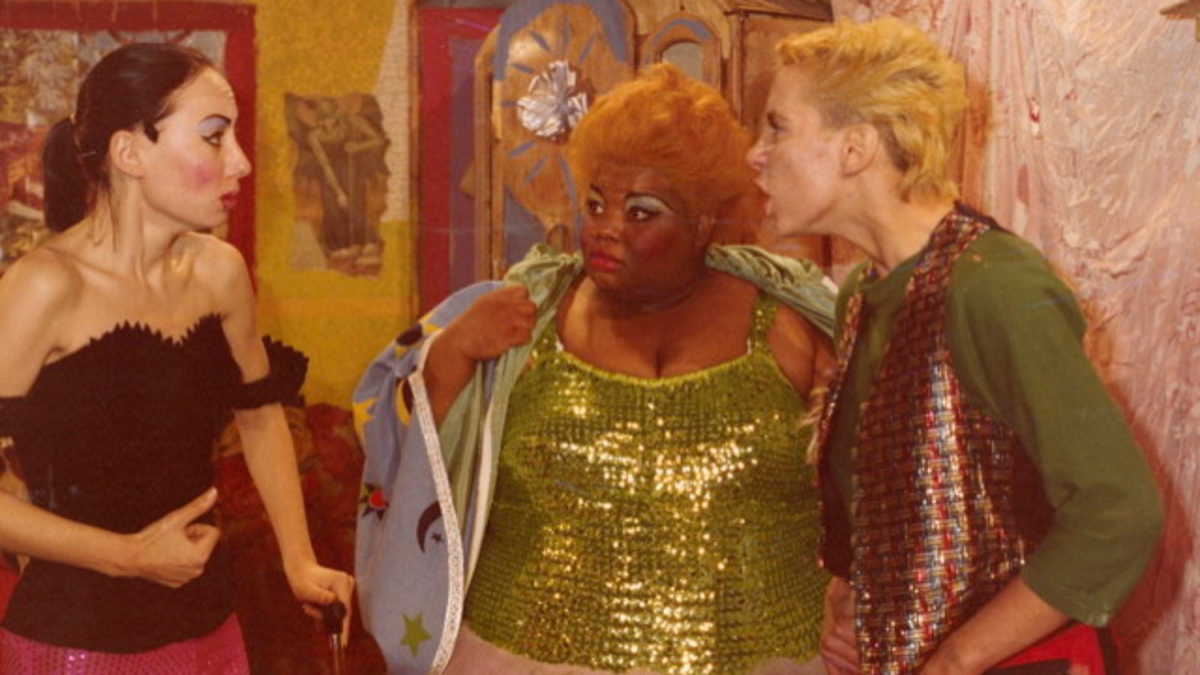 Jean Hill and Susan Lowe look at Mink Stole