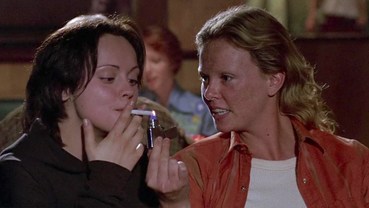 Best lesbian movies #95: Charlize Theron lights Christina Ricci's cigarette in Monster
