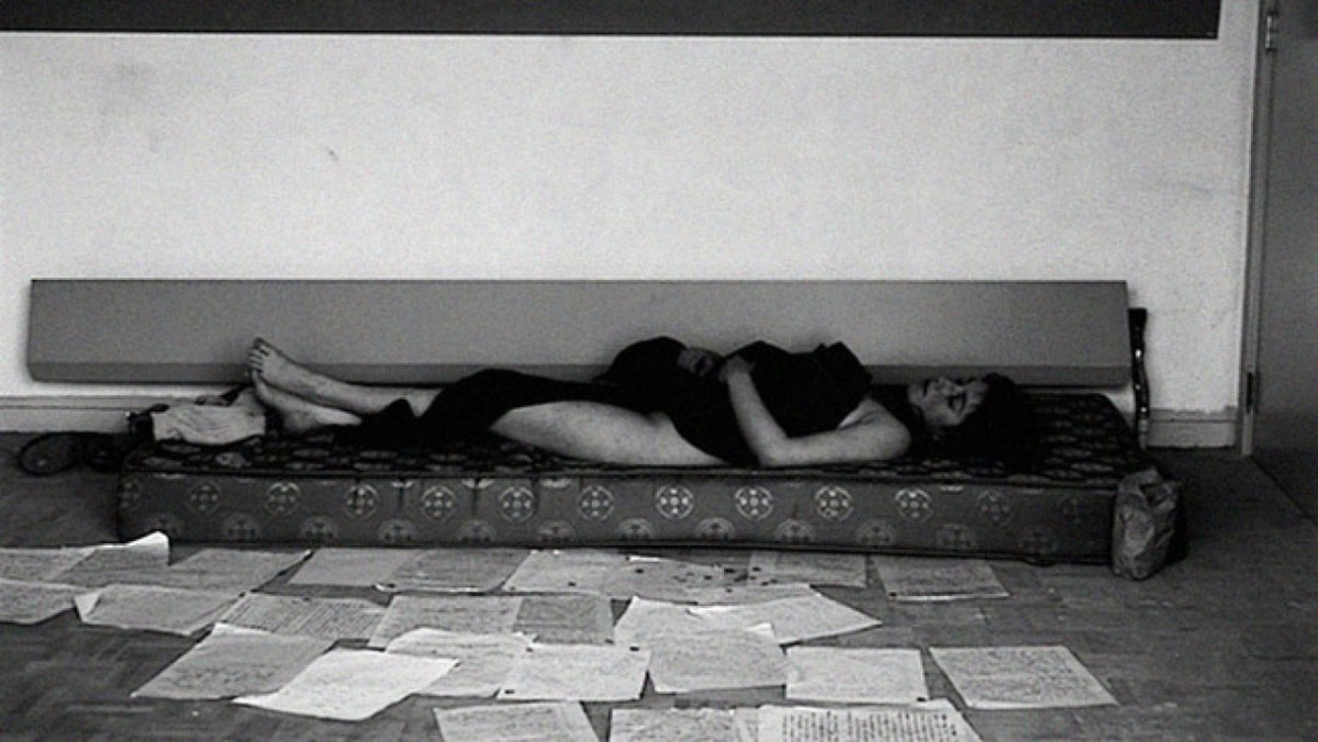 woman lying on her couch in despiair