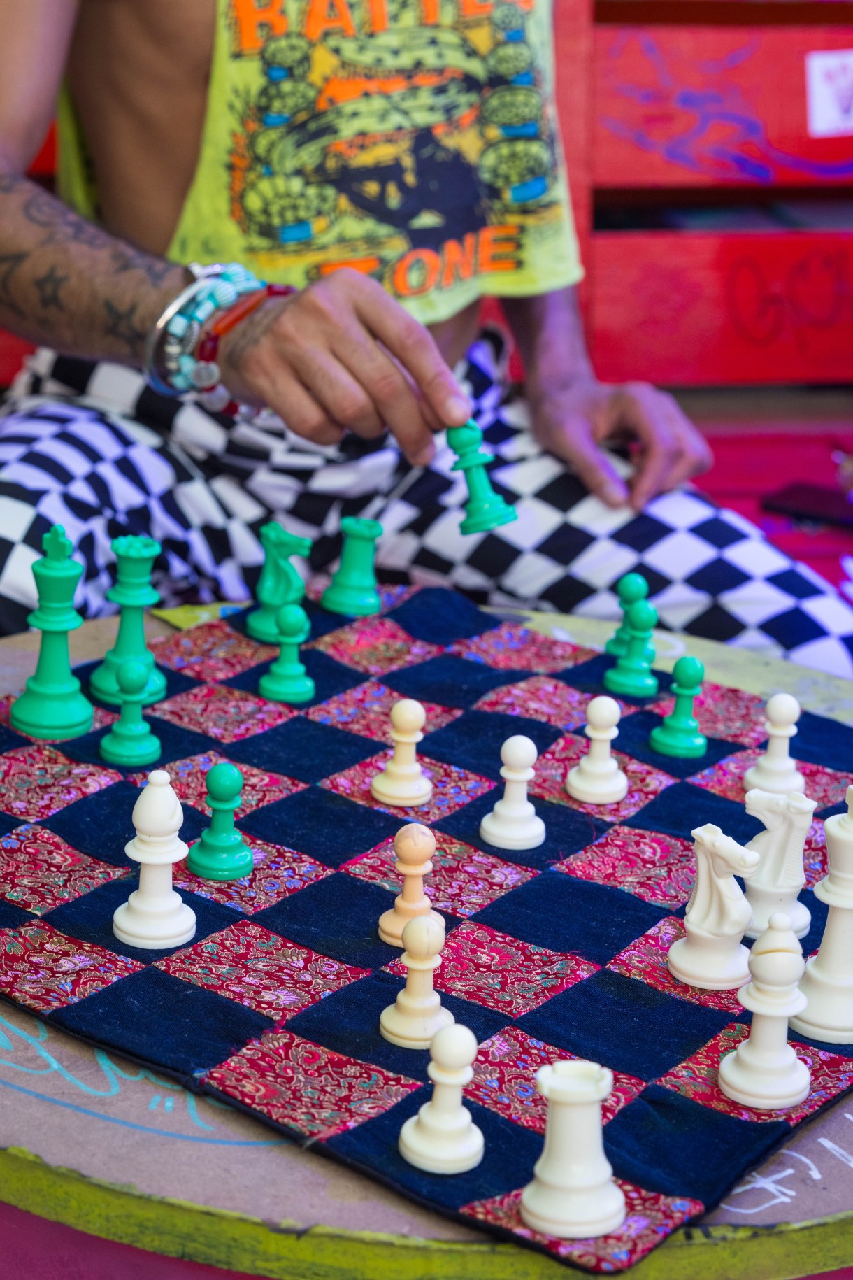 a person moving a chess piece