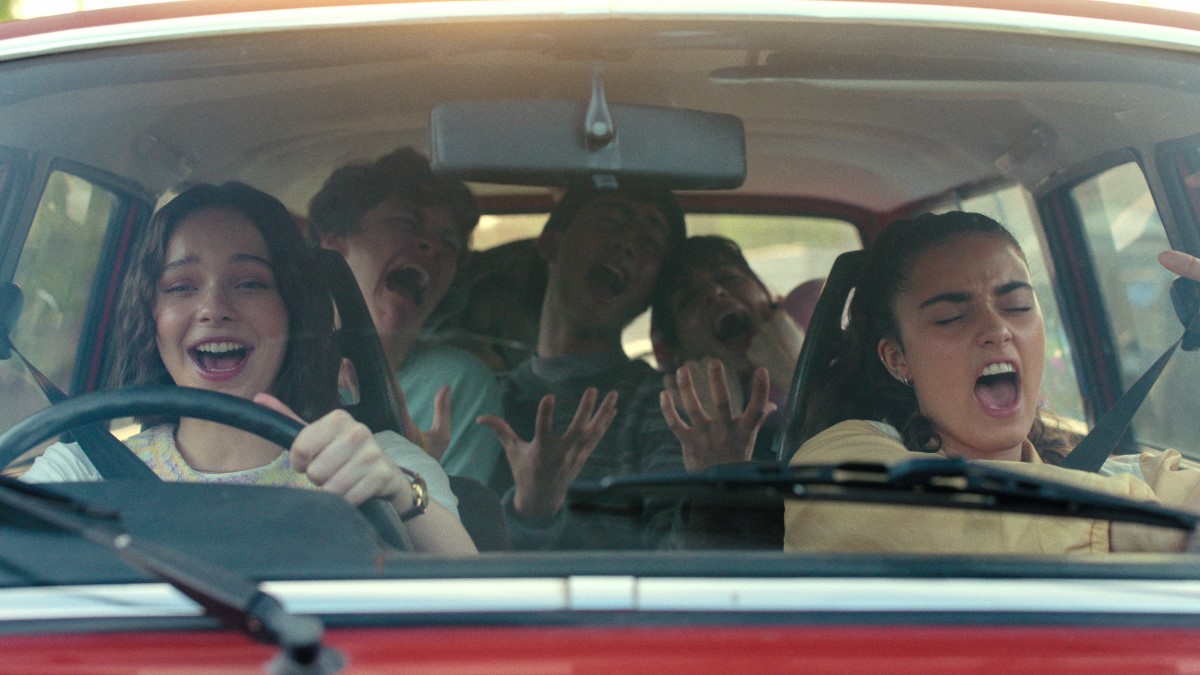 The teens of A Good Girl's Guide to Murder sing together in a car