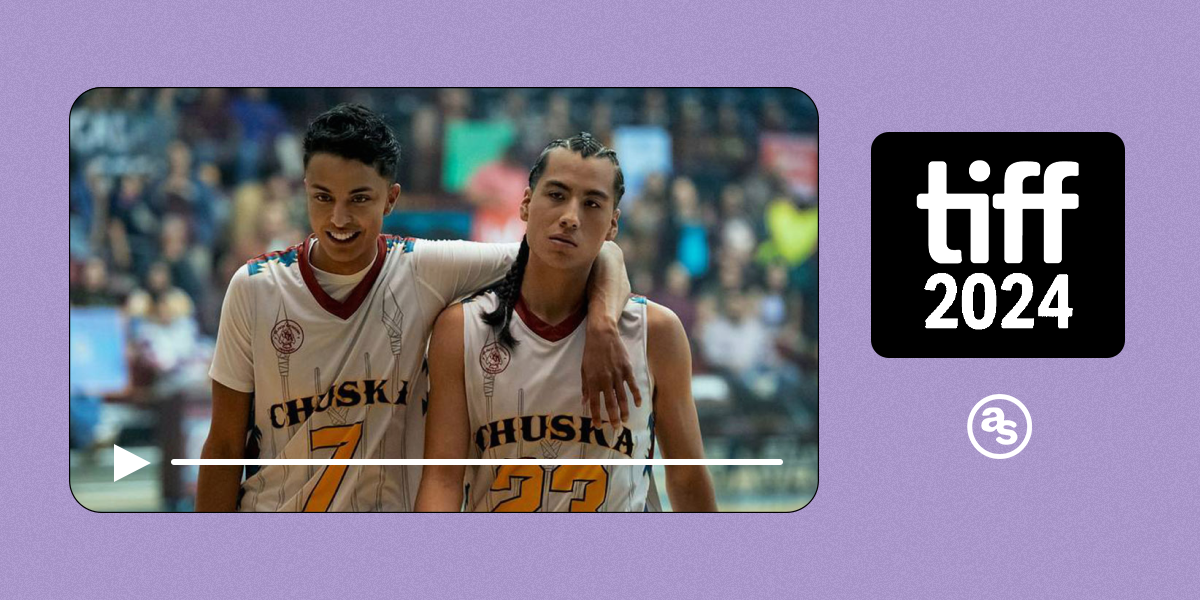 Two Indigenous teen boys in basketball jerseys pose with an arm around each other in Rez Ball.