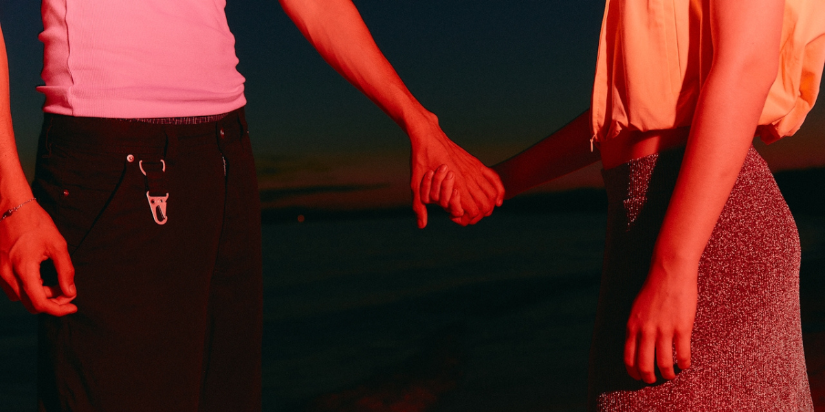 two people holding hands