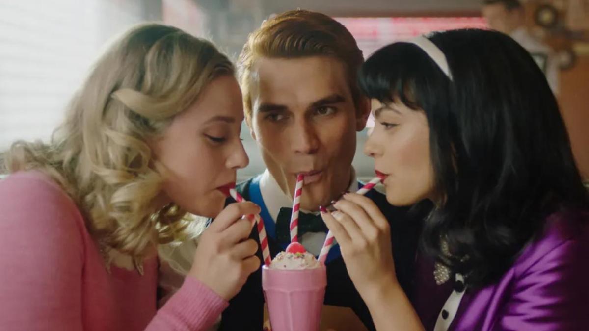 archie, veronica and betty sharing a milkshake