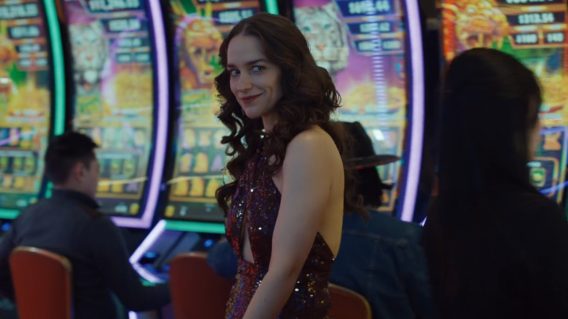 Wynonna Earp Vengeance: Wynonna smirks as she struts through a casino