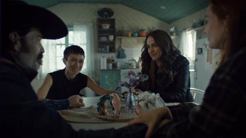 wynonna earp vengeance: wynonna, waverly, nicole, and doc hold hands around the table