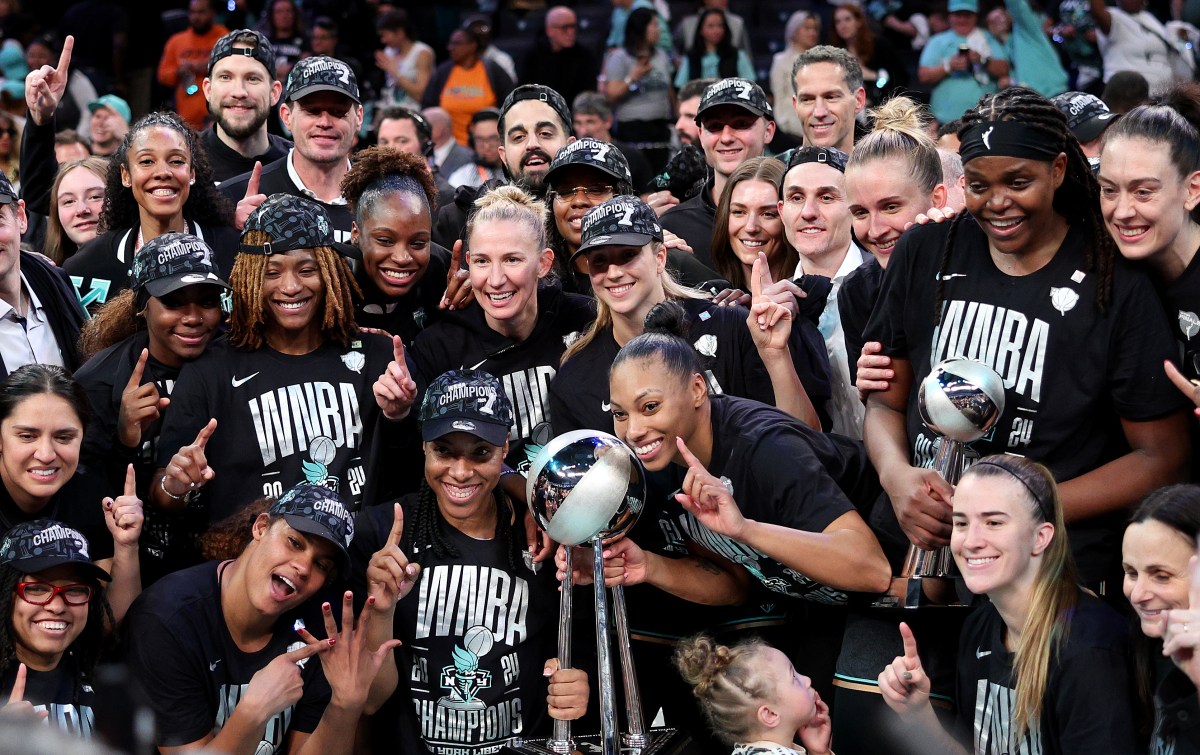 NEW YORK, NEW YORK - OCTOBER 20: The New York Liberty pose after the win over Minnesota Lynx in Game Five of the WNBA Finals at Barclays Center on October 20, 2024 in the Brooklyn borough of New York City. The New York Liberty defeated the Minnesota Lynx 67-62 in overtime to win the championship. NOTE TO USER: User expressly acknowledges and agrees that, by downloading and or using this photograph, User is consenting to the terms and conditions of the Getty Images License Agreement. (Photo by Elsa/Getty Images)