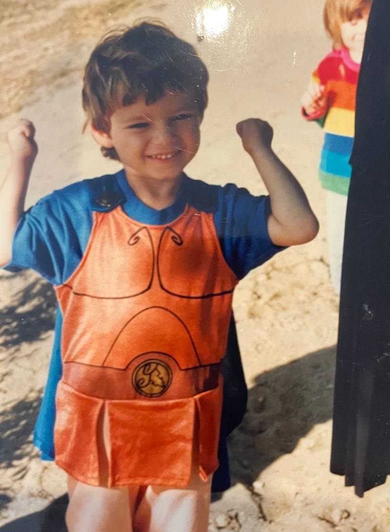 Drew, age 3, flexes wearing a Hercules costume