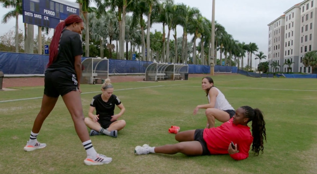 girls stretching on the field