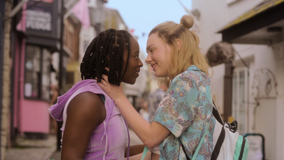 Heartstopper: Darcy and Tara smile after a kiss