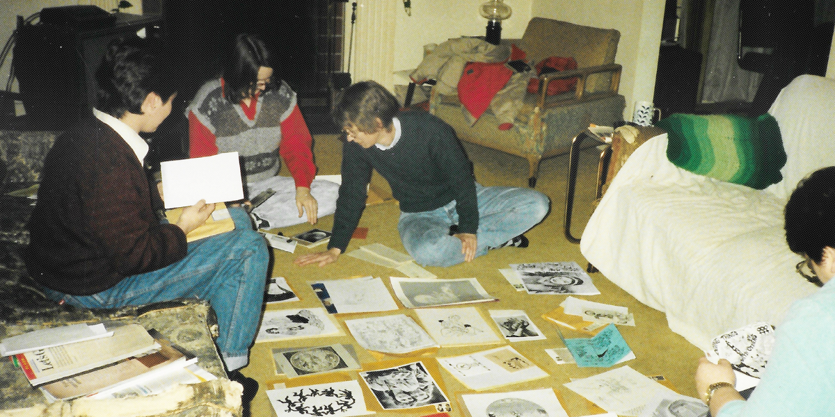 lesbians putting together a magazine on the floor