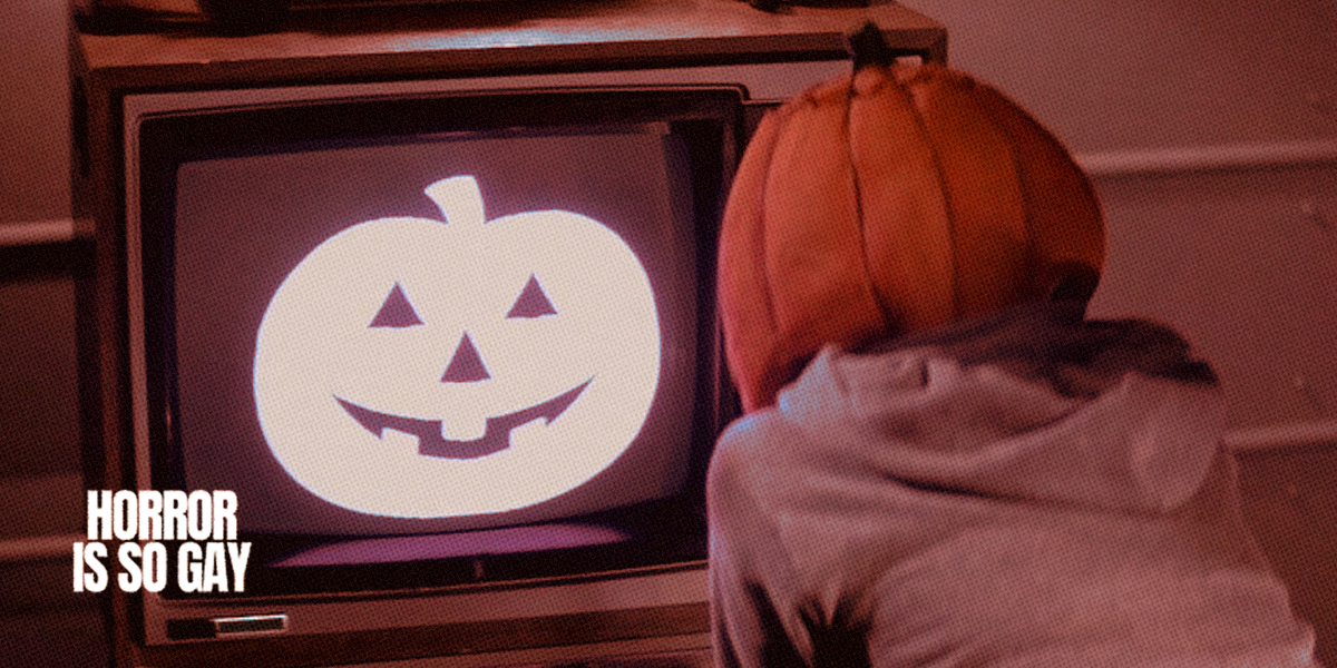 a kid with a pumpkin mask watching a jack-o-lantern on a screen