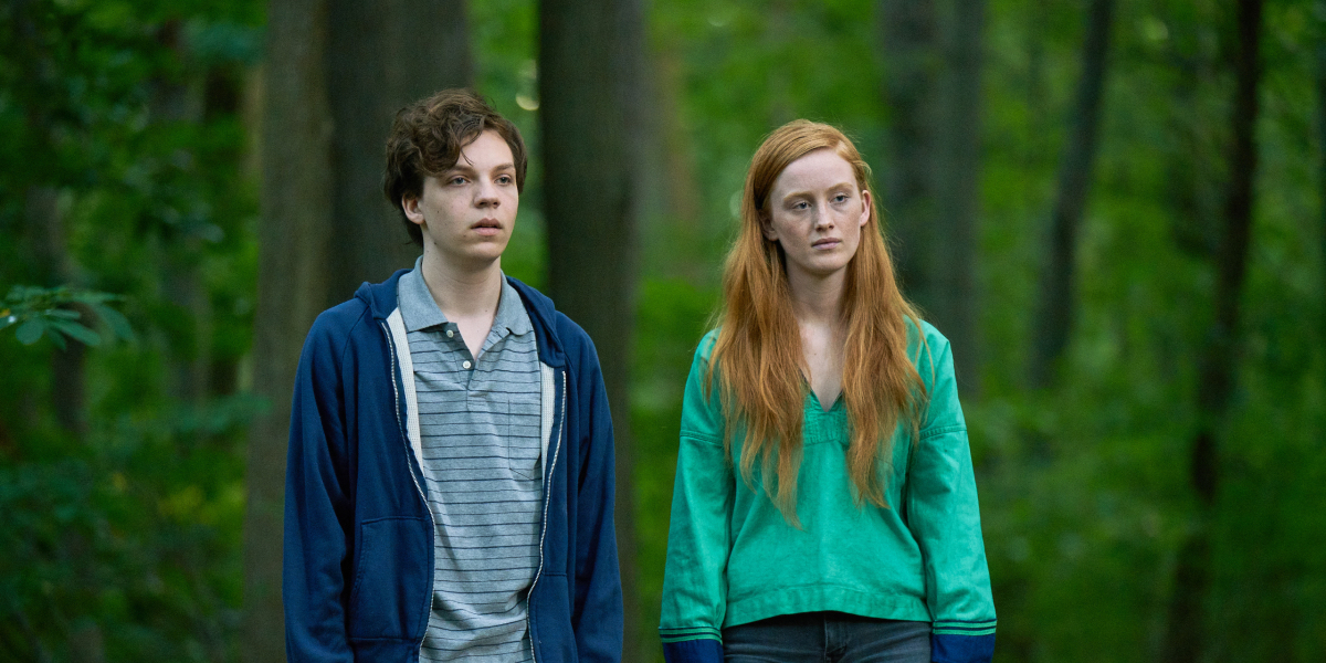 Nicholas Alexander and Bobbi Salvör Menuez stand side by side in the woods in Adam (2019)