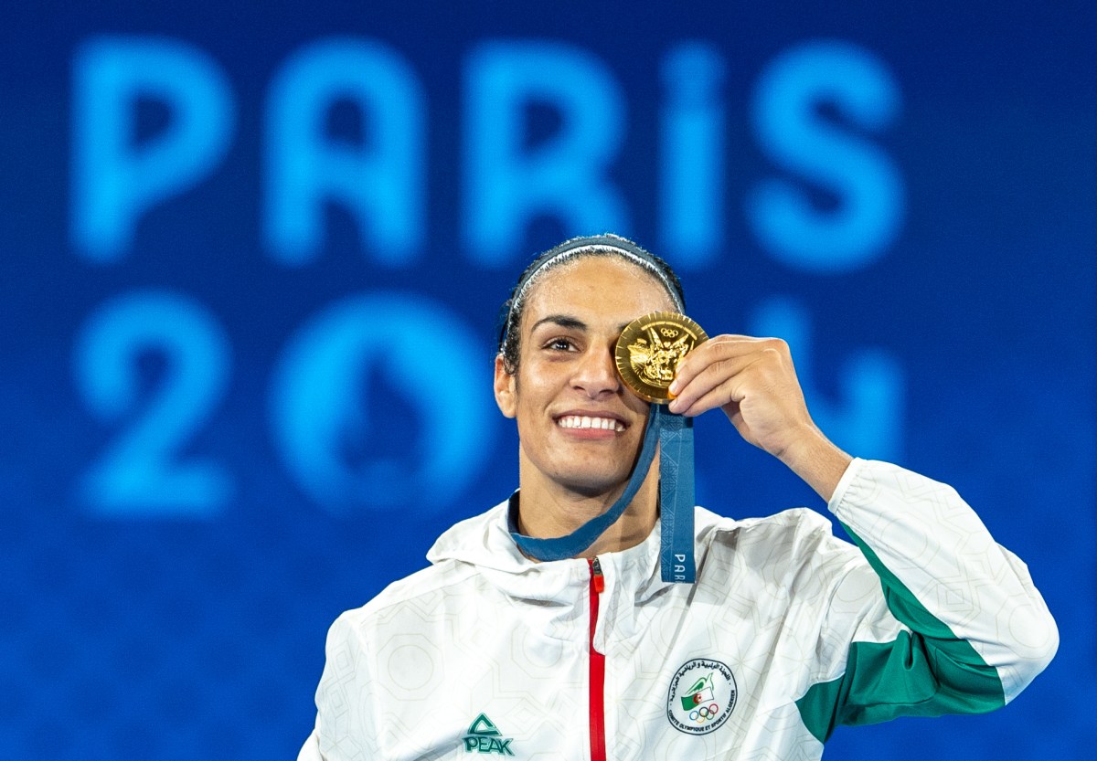 PARIS, FRANCE - AUGUST 09: Imane xKhelif of Team Algeria celebrates as she wins gold medal after defeating Liu Yang (blue) of China in the Boxing Women's 66kg Final match on day fourteen of the Olympic Games Paris 2024 at Roland Garros on August 09, 2024 in Paris, France. (Photo by Aytac Unal/Anadolu via Getty Images)