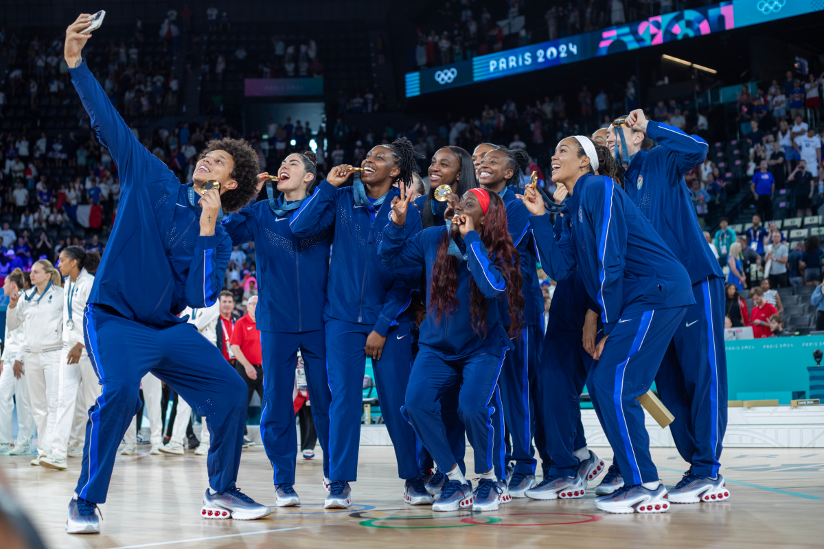 Olympic women's basketball team celebrates a gold medal