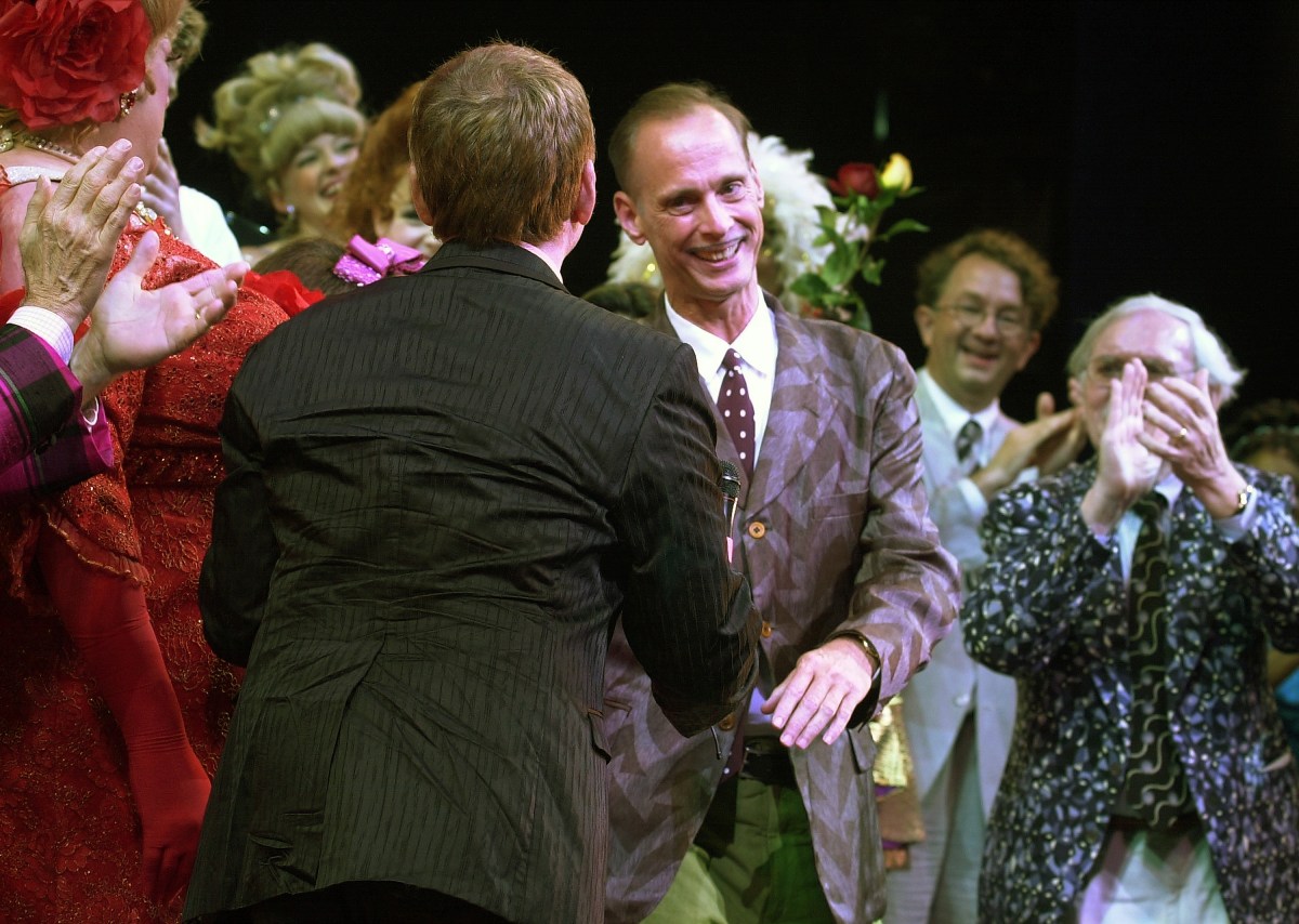 John Waters is greeted by the cast of "Hairspray" during a curtain call following the opening performance of the musical at the Neil Simon Theatre. The new Broadway show is based on the 1988 movie which Waters wrote and directed. (Photo by James Keivom/NY Daily News Archive via Getty Images)