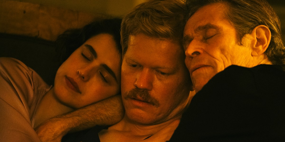 Jesse Plemons looks distraught as he is cuddled by Willem Dafoe and Margaret Qualley