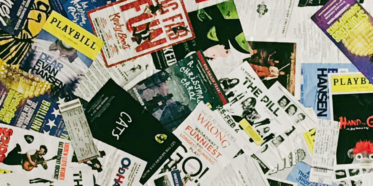 a stack of Broadway playbills