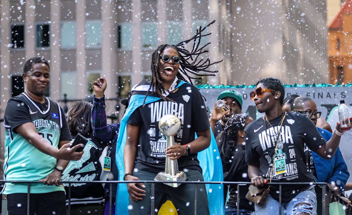 New York City, N.Y.: New York Liberty Jonquel Jones holds the MVP trophy during the ticker-tape parade at New York City Hall ceremony honoring the team as WNBA Champions, on Oct. 24, 2024. (Photo by J. Conrad Williams Jr./Newsday RM via Getty Images)