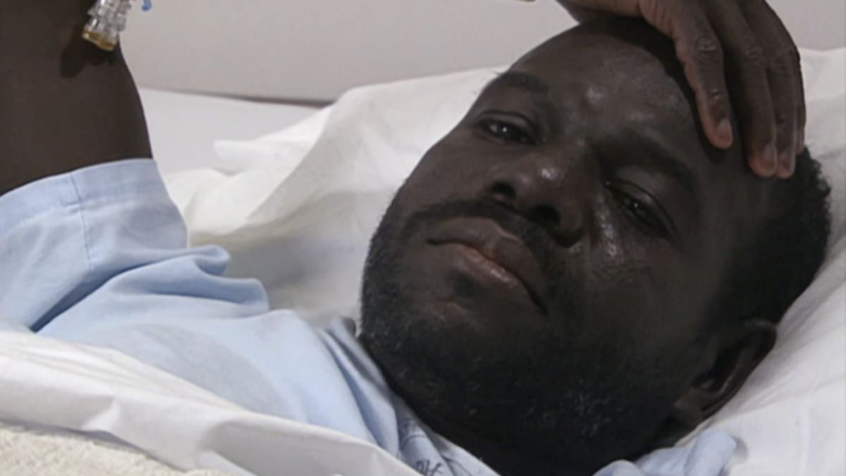 A close up of Marlon Riggs in a hospital bed.