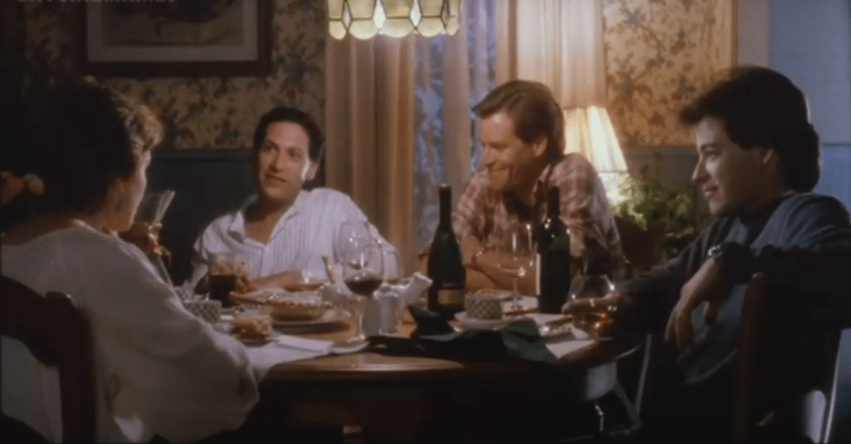 Harvey Fierstein, Matthew Broderick, and two others sit around chatting at a table.