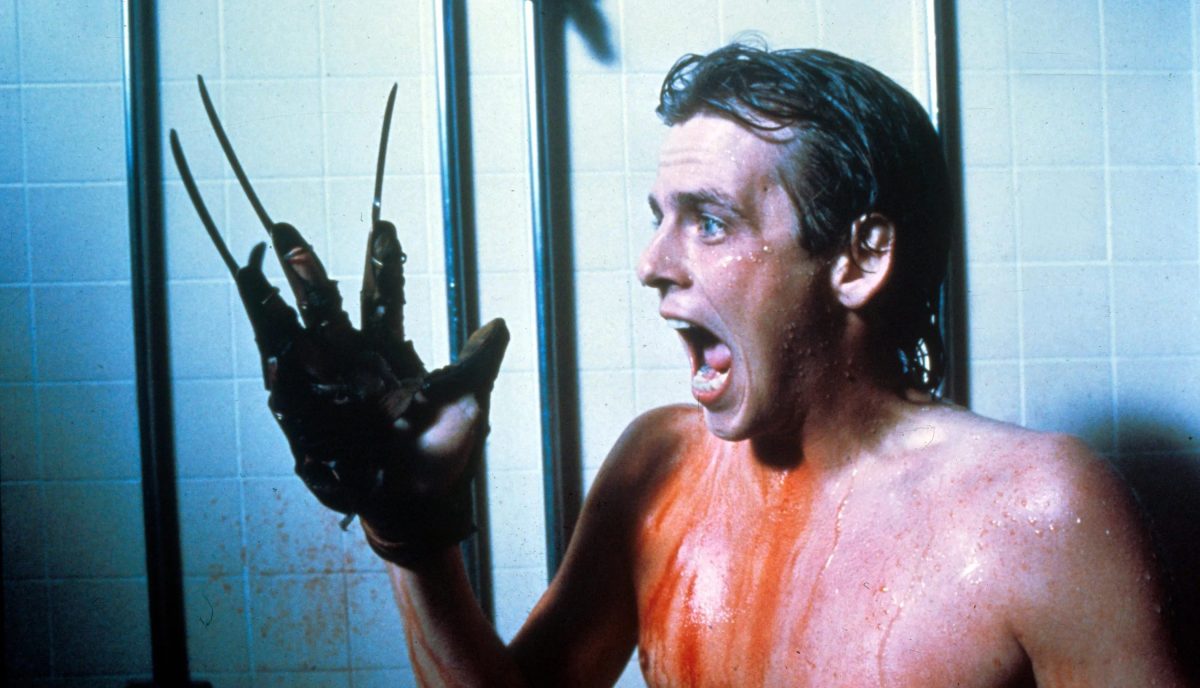 The best gay male movies of all time: Mark Patton screams as his hand has the Freddy Krueger claw.