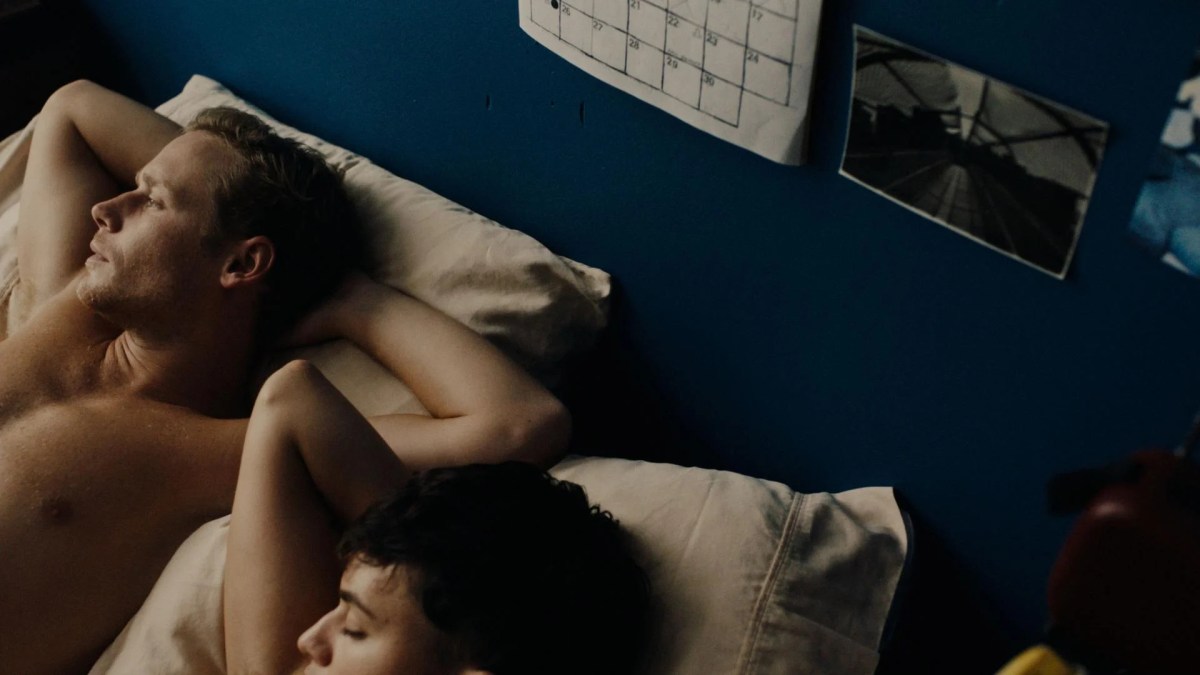 The best gay male movies of all time: An abstracted shot of two men lying in bed in the bottom left of the frame.