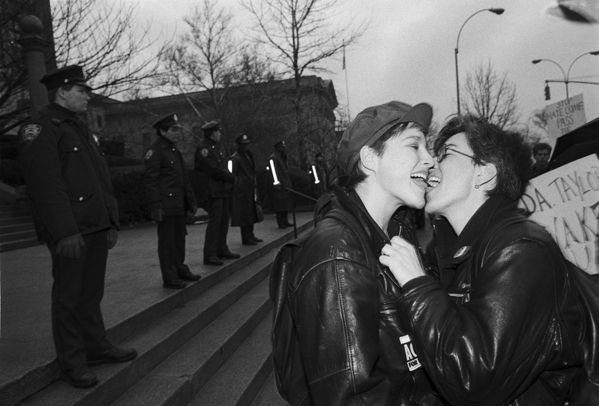 Two Women kissing in front of a line of police officers during a gay rights demonstration in Staten Island in New York. (Photo by Thomas McGovern/Getty Images.