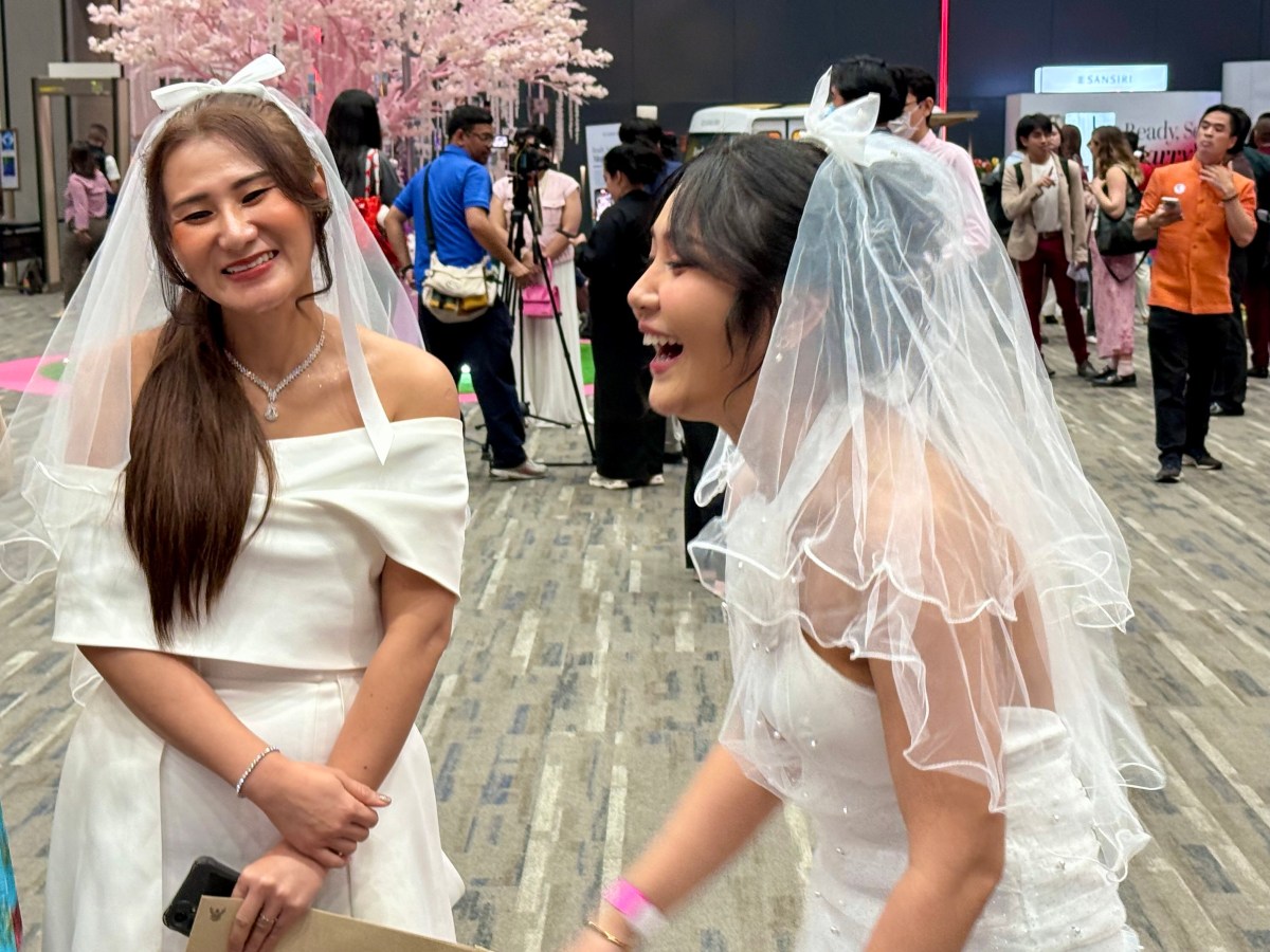 23 January 2025, Thailand, Bangkok: Two brides beam on the first day of "marriage for all" in Thailand at Paragon Hall. A mass wedding has been taking place there since the morning. The Thai government approved the law on same-sex marriages last year. It has now come into force. Photo: Carola Frentzen/dpa (Photo by Carola Frentzen/picture alliance via Getty Images)