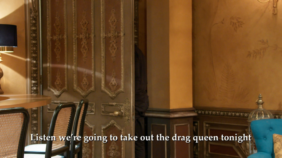 An image of an empty room with text on the bottom that reads: We're going to take out the drag queen tonight.