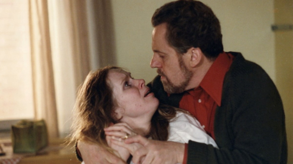 Liv Ullmann cries as Erland Josephson holds onto her